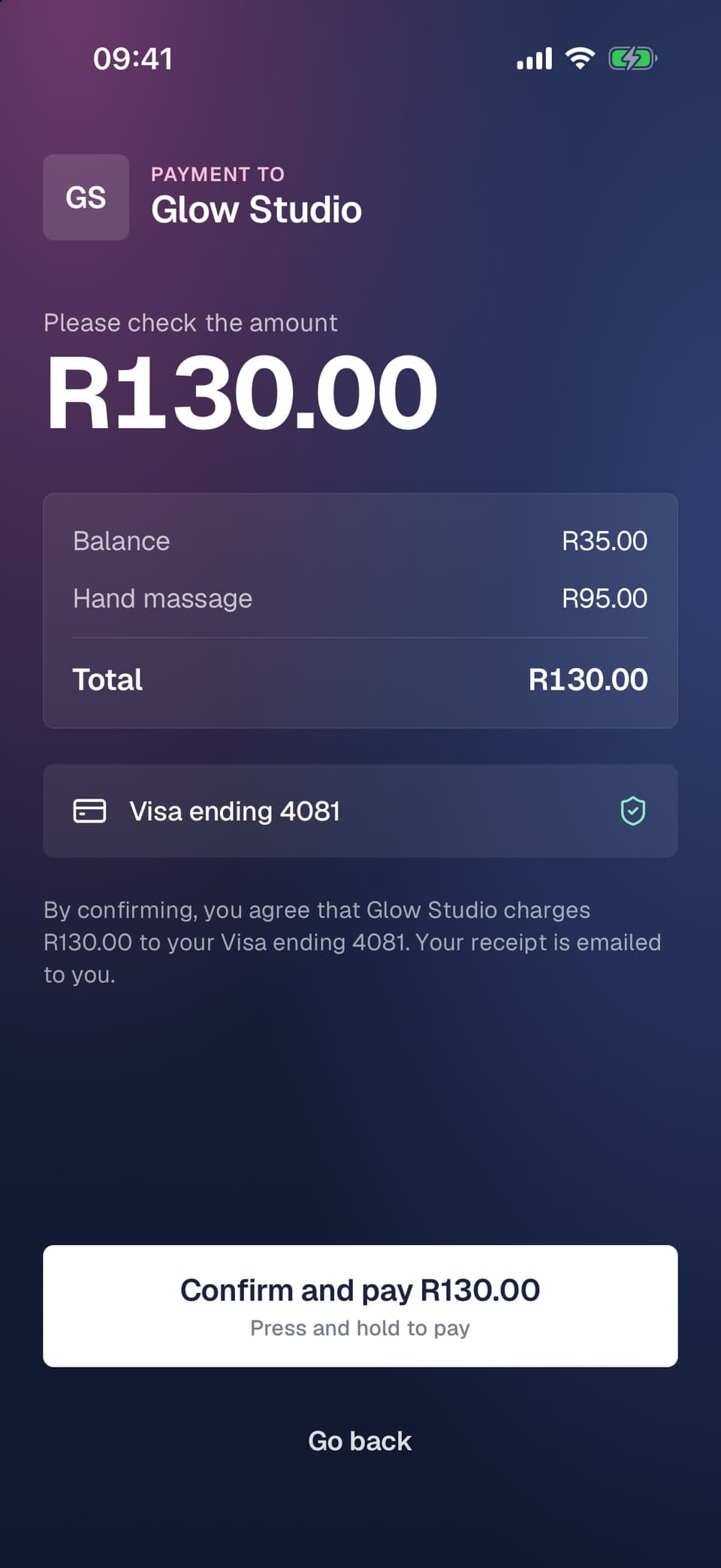 Screen the customer sees with the total, each line, their card and a press-and-hold Confirm and pay button