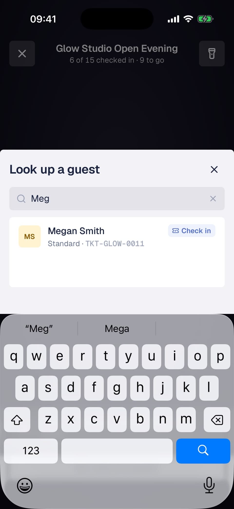 Look up a guest panel over the scanner with a search result and a Check in label
