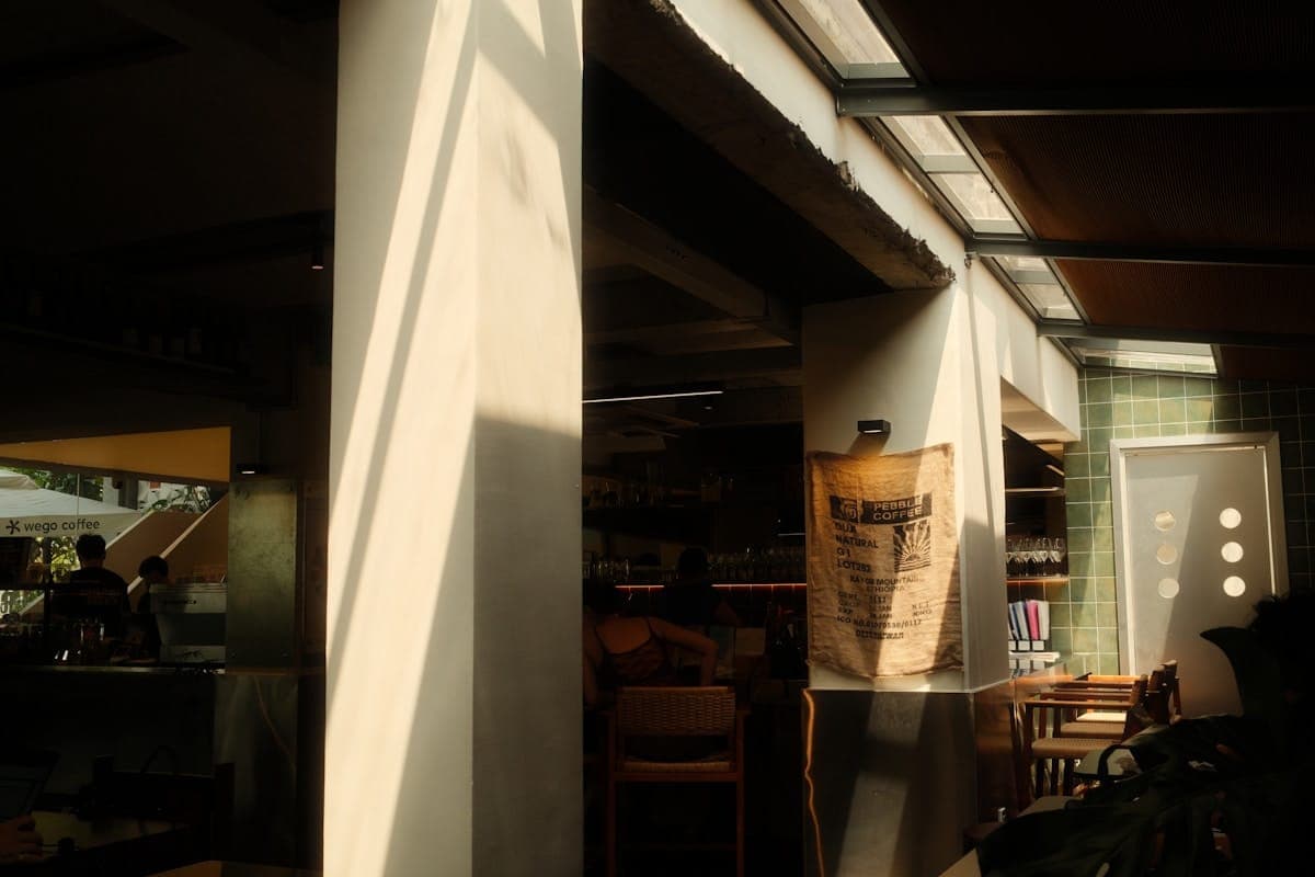 Morning sun streaming through the windows of a quiet café.